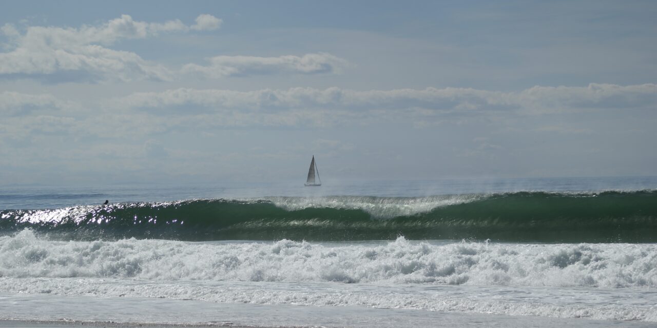 Surfer riding a wave at Hossegor, France